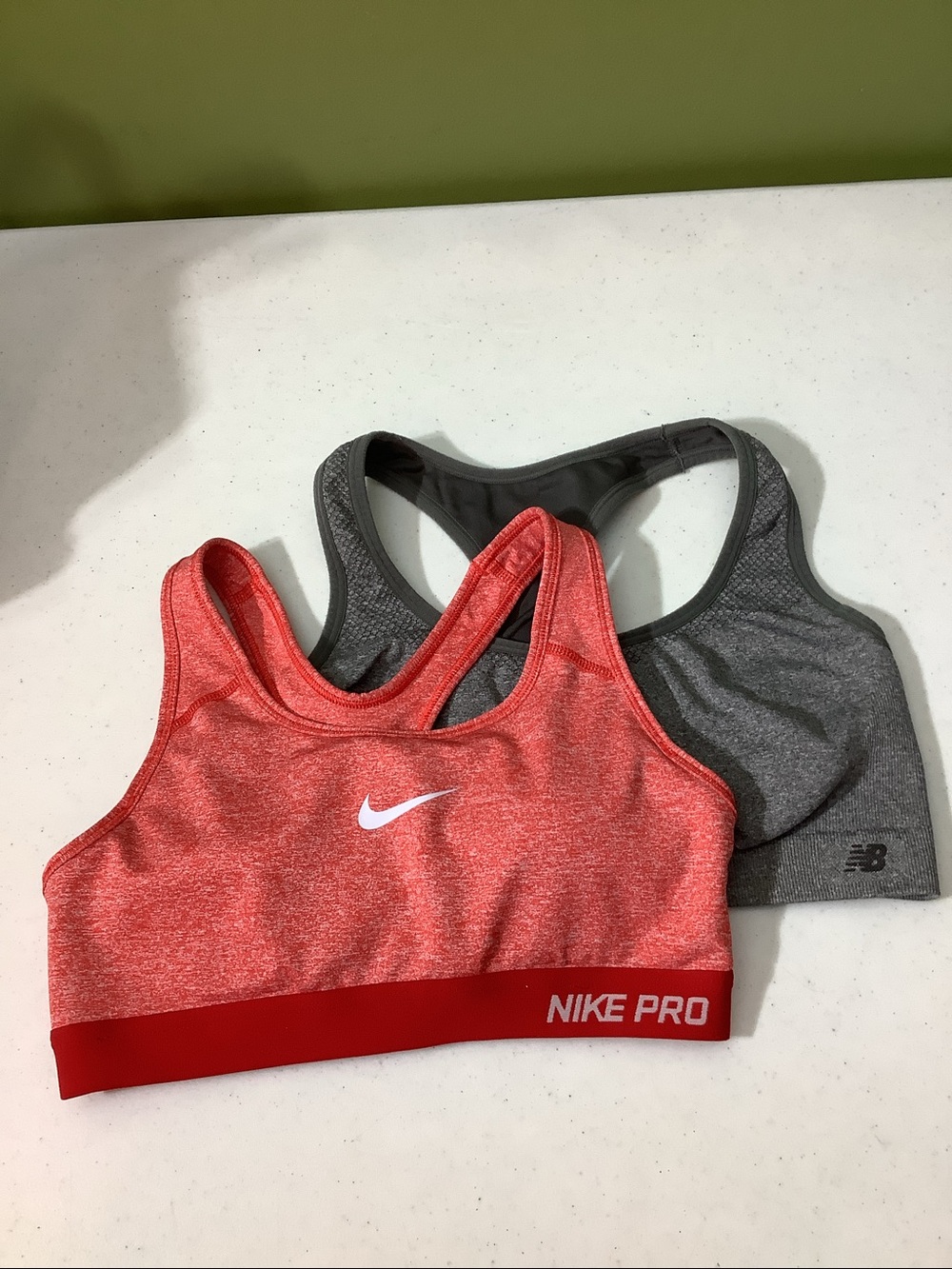 2-pack Nike and New balance sports bras, size small